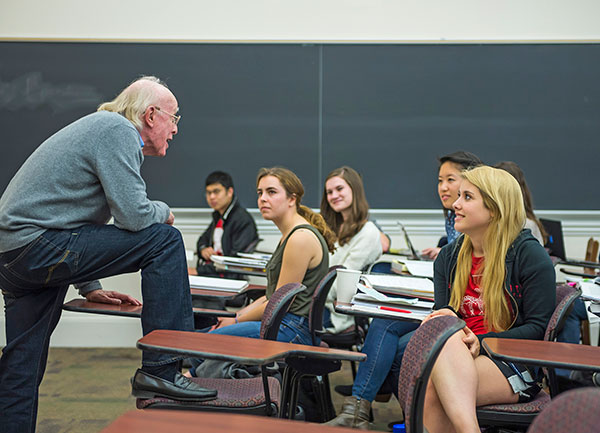 Dennis Huston commands the classroom stage during a spring semester course. 